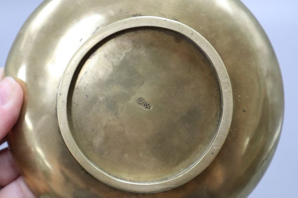 A late 19th century Chinese engraved bronze dish, two character mark, diameter 14cm